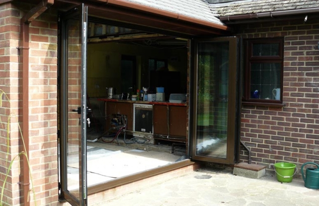 Aluminium bi-fold doors, (open).