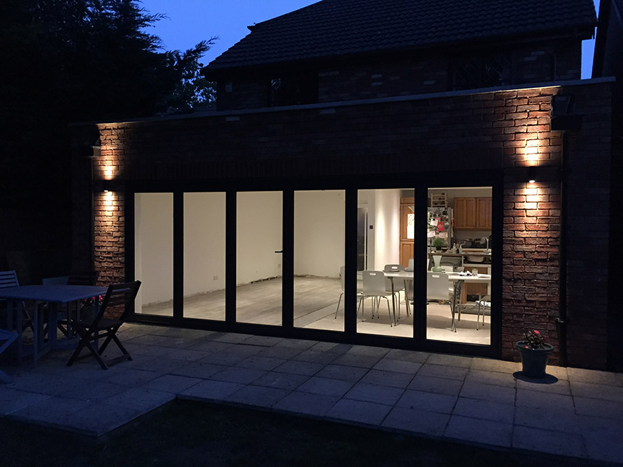 Anthracite grey aluminium bi-folding doors, 6 sections, (closed).