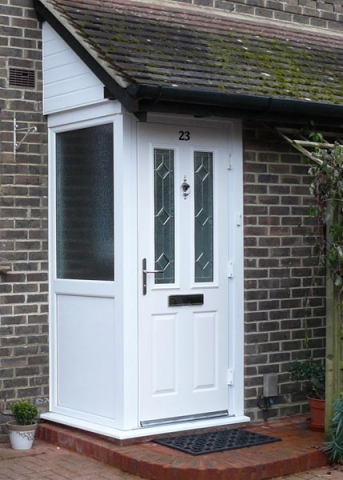 Enclosed porch and step.